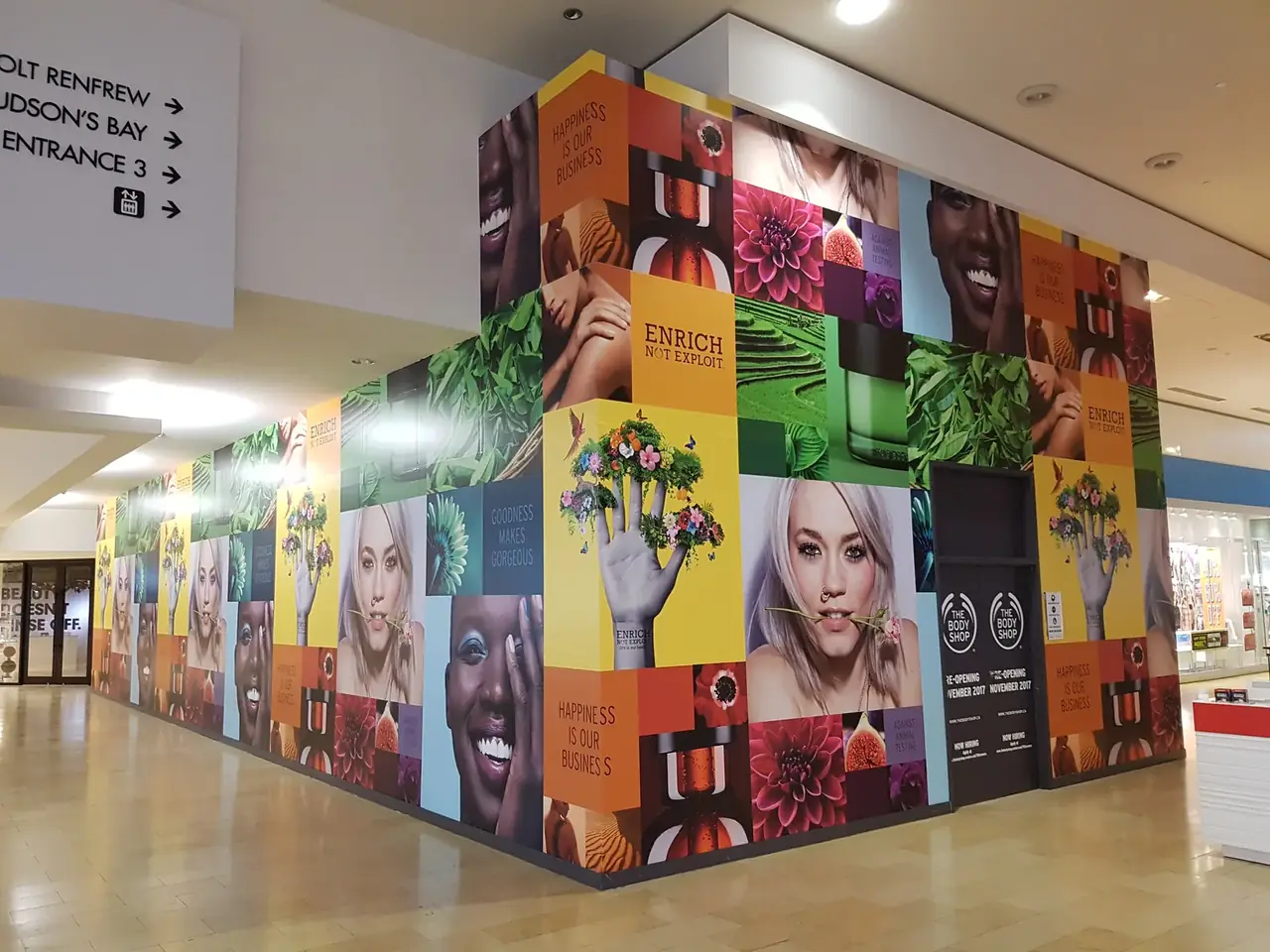 Large colourful retail hoarding mural installed at a shopping mall by Performance Graphics
