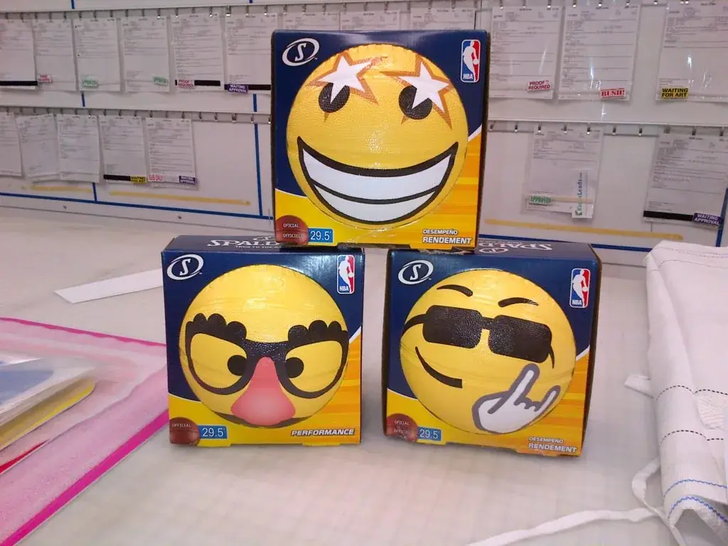 Basketballs wrapped in yellow emoji graphics for the NBA All-Star Game by Performance Graphics